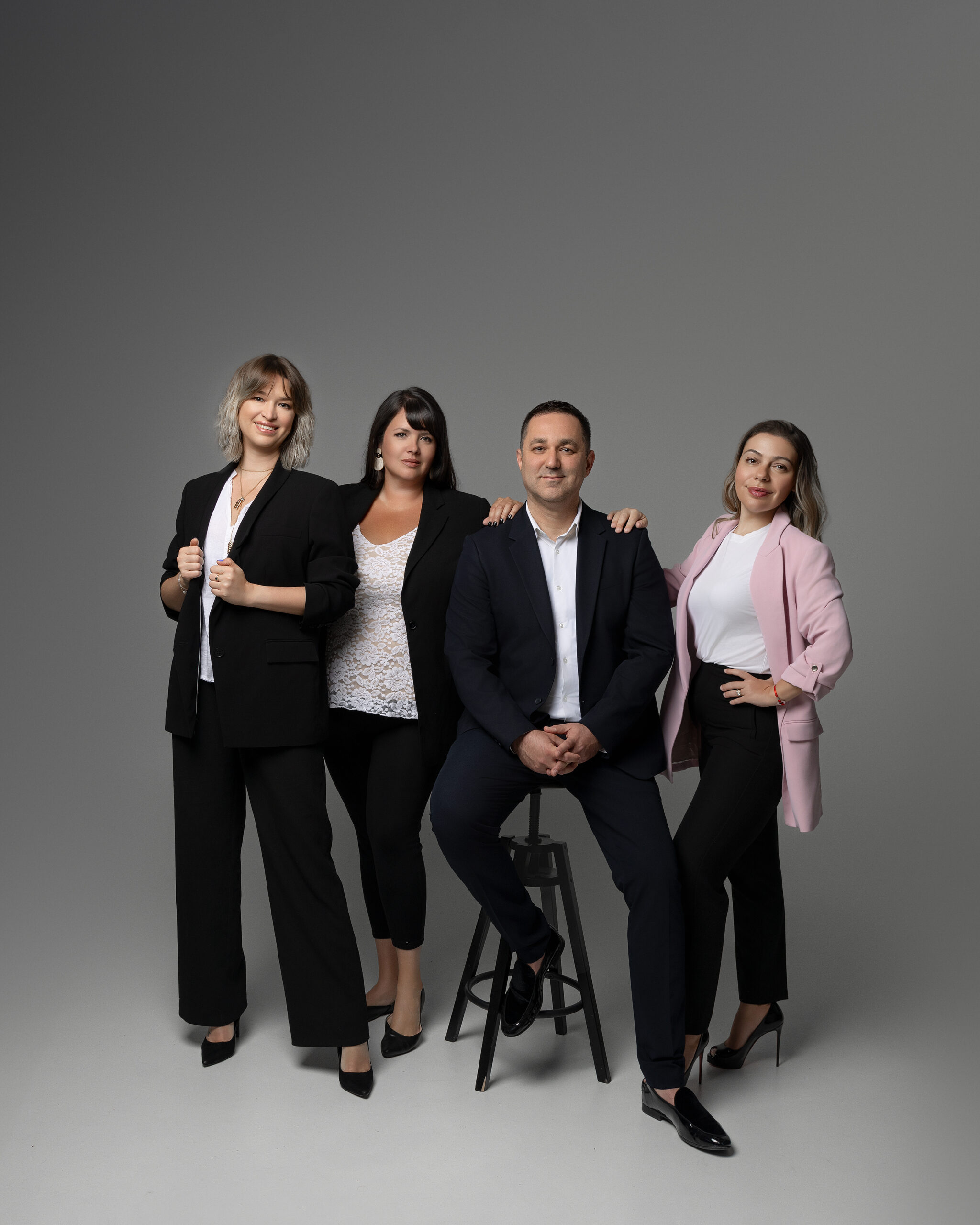 three women at a reception desk at a photography studio